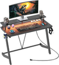 Gaming Desk with Power Outlets & Music Strip Lights,Computer Desk with Large Monitor Stand, PC Laptop Table for Small Spaces, Gamer Workstation with Cup Holder, Headphone Hook for Home Office